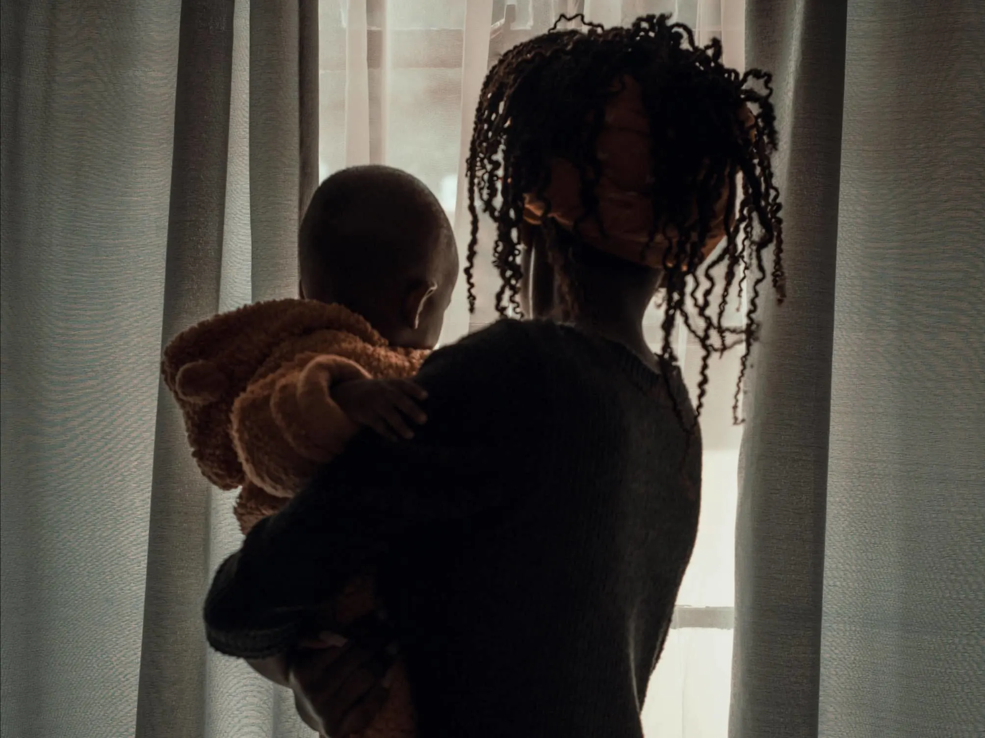 Parent holding a child